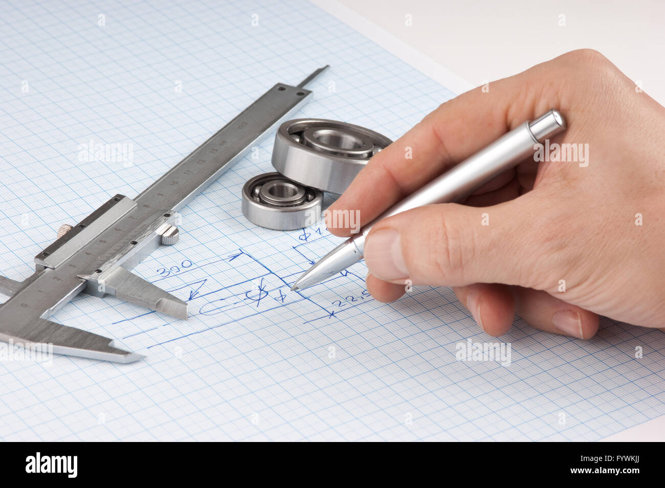 pen in hand and  technical drawing Stock Photo