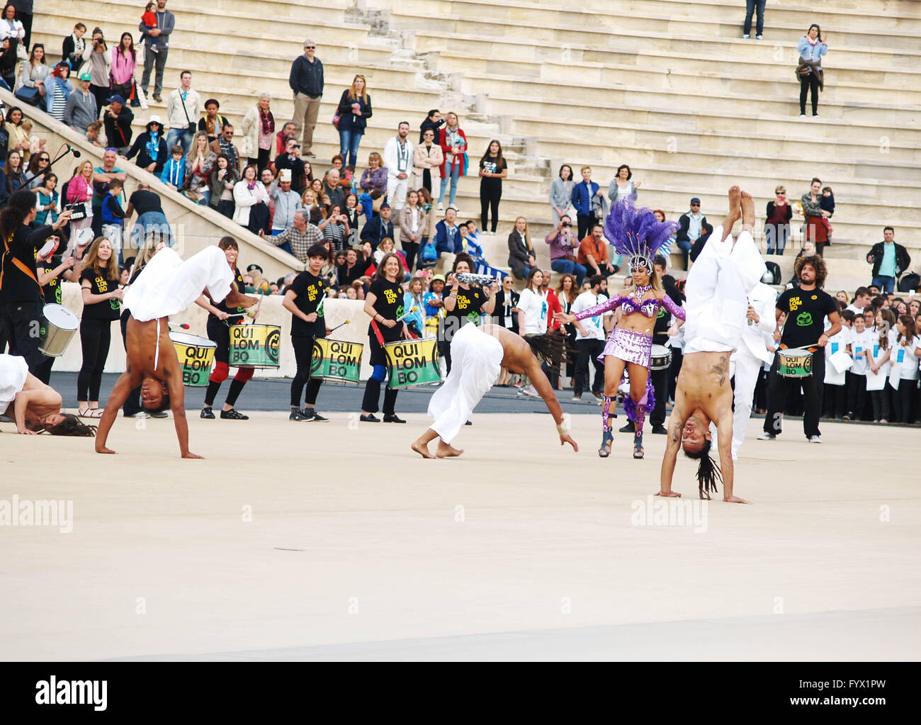 Members of a Brazilan dancing group are dancing after the Olympic Flame ...