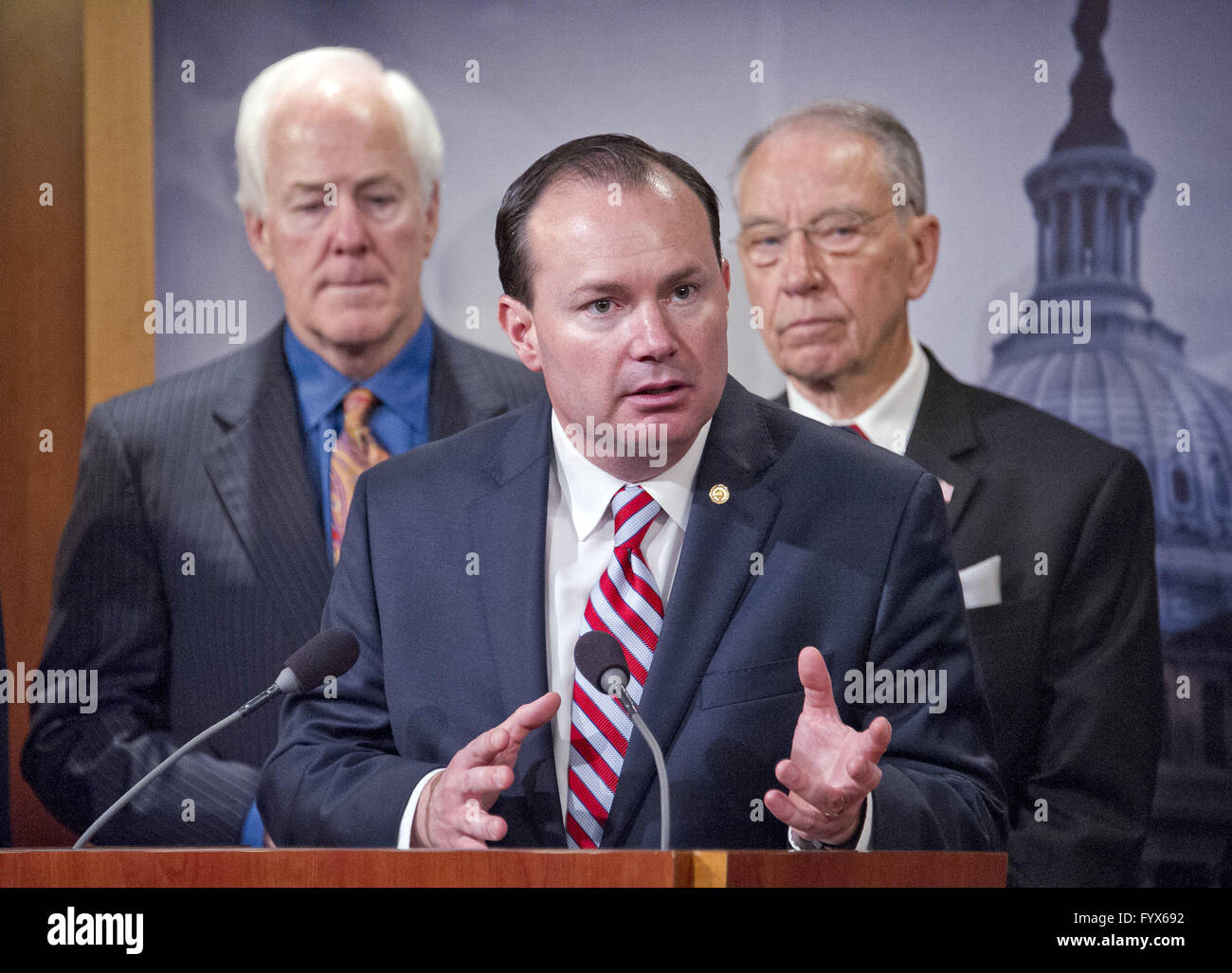 April 28, 2016 - Washington, District of Columbia, United States of America - United States Senator Mike Lee (Republican of Utah) makes remarks during a press conference calling on the US Senate Republican leadership to bring to the floor the bipartisan Sentencing Reform and Corrections Act, a bill to reduce some mandatory minimum sentences and apply those changes retroactively to inmates currently serving unfair sentences. Standing behind Sen. Lee are US Senator John Cornyn (Republican of Texas), left, and US Senator Chuck Grassley (Republican of Iowa), right.Credit: Ron Sachs/CNP (Credit Stock Photo