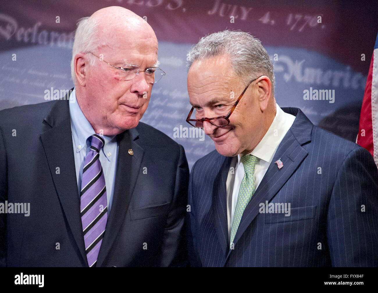 United States Senators Patrick Leahy (Democrat of Vermont), left, and Chuck Schumer (Democrat of New York), right, speak to one another during a press conference calling on the US Senate Republican leadership to bring to the floor the bipartisan Sentencing Reform and Corrections Act, a bill to reduce some mandatory minimum sentences and apply those changes retroactively to inmates currently serving unfair sentences. Credit: Ron Sachs/CNP - NO WIRE SERVICE - Stock Photo