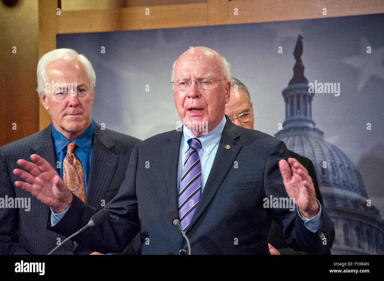 United States Senator Patrick Leahy (Democrat of Vermont), Ranking Member, US Senate Judiciary Committee, makes remarks during a press conference calling on the US Senate Republican leadership to bring to the floor the bipartisan Sentencing Reform and Corrections Act, a bill to reduce some mandatory minimum sentences and apply those changes retroactively to inmates currently serving unfair sentences. US Senator John Cornyn (Republican of Texas) looks on from left. Credit: Ron Sachs/CNP - NO WIRE SERVICE - Stock Photo