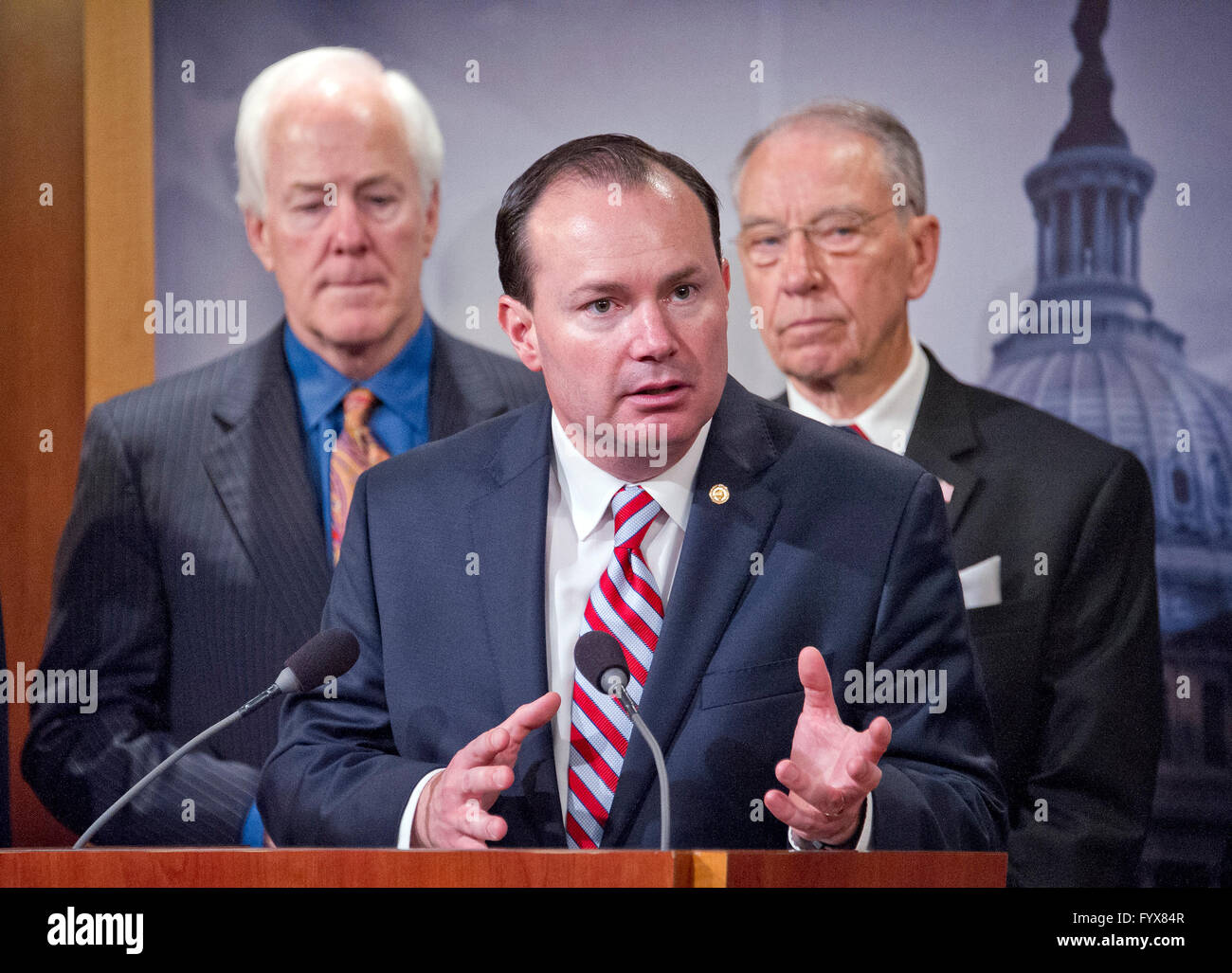 United States Senator Mike Lee (Republican of Utah) makes remarks during a press conference calling on the US Senate Republican leadership to bring to the floor the bipartisan Sentencing Reform and Corrections Act, a bill to reduce some mandatory minimum sentences and apply those changes retroactively to inmates currently serving unfair sentences. Standing behind Sen. Lee are US Senator John Cornyn (Republican of Texas), left, and US Senator Chuck Grassley (Republican of Iowa), right. Credit: Ron Sachs/CNP - NO WIRE SERVICE - Stock Photo