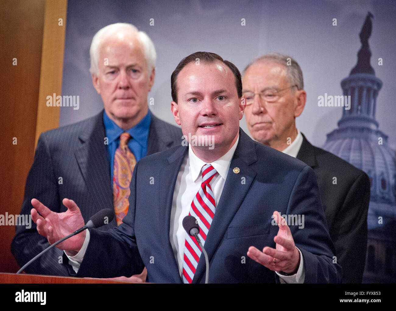 United States Senator Mike Lee (Republican of Utah) makes remarks during a press conference calling on the US Senate Republican leadership to bring to the floor the bipartisan Sentencing Reform and Corrections Act, a bill to reduce some mandatory minimum sentences and apply those changes retroactively to inmates currently serving unfair sentences. Standing behind Sen. Lee are US Senator John Cornyn (Republican of Texas), left, and US Senator Chuck Grassley (Republican of Iowa), right. Credit: Ron Sachs/CNP - NO WIRE SERVICE - Stock Photo