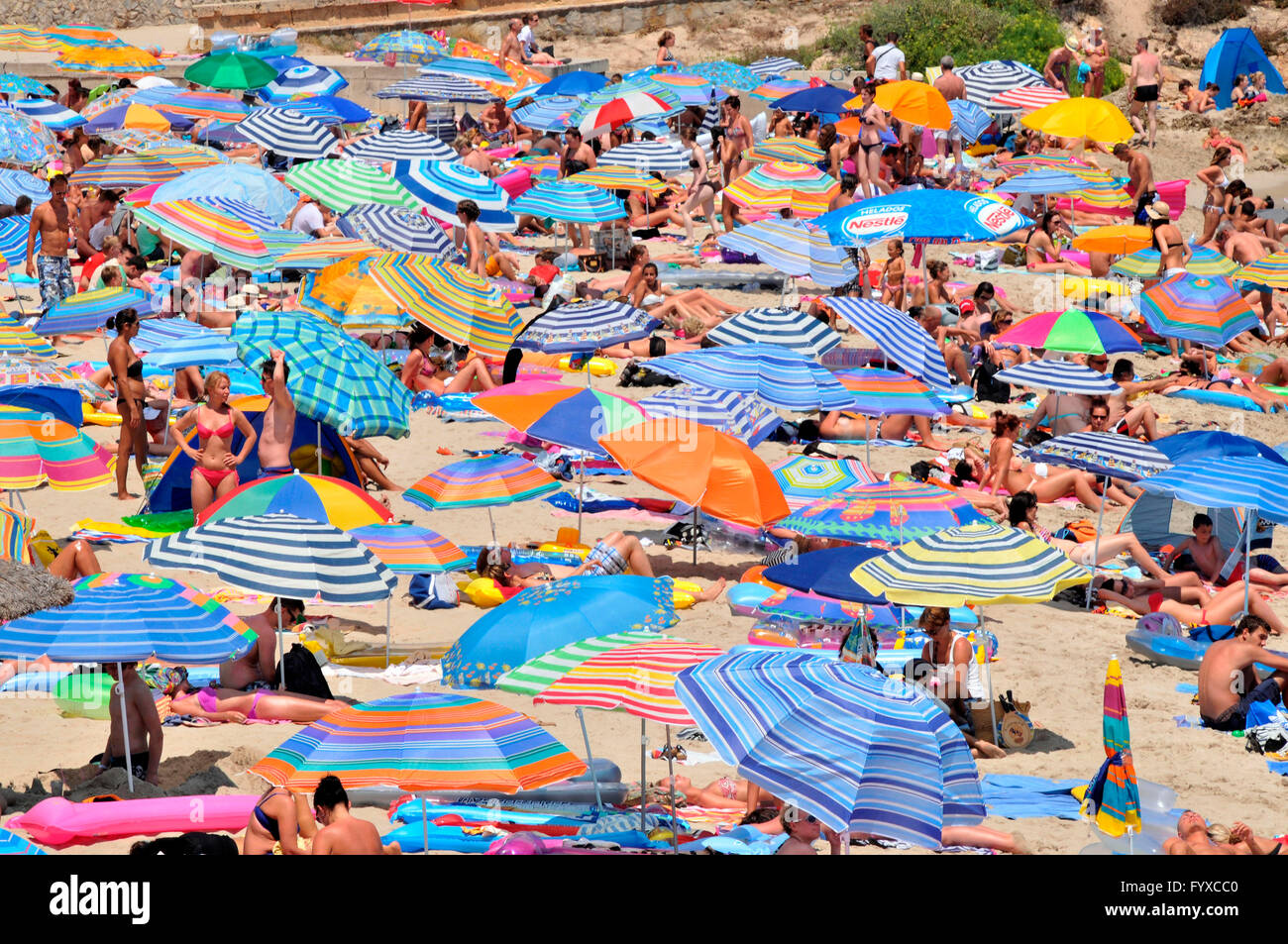 Beach Son Moll, Cala Rajada, Mallorca, Spain / Cala Ratjada, sunshades Stock Photo