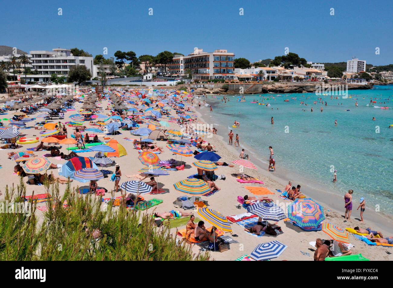 Beach Son Moll, Cala Rajada, Mallorca, Spain  / Cala Ratjada, sunshades, bay Stock Photo