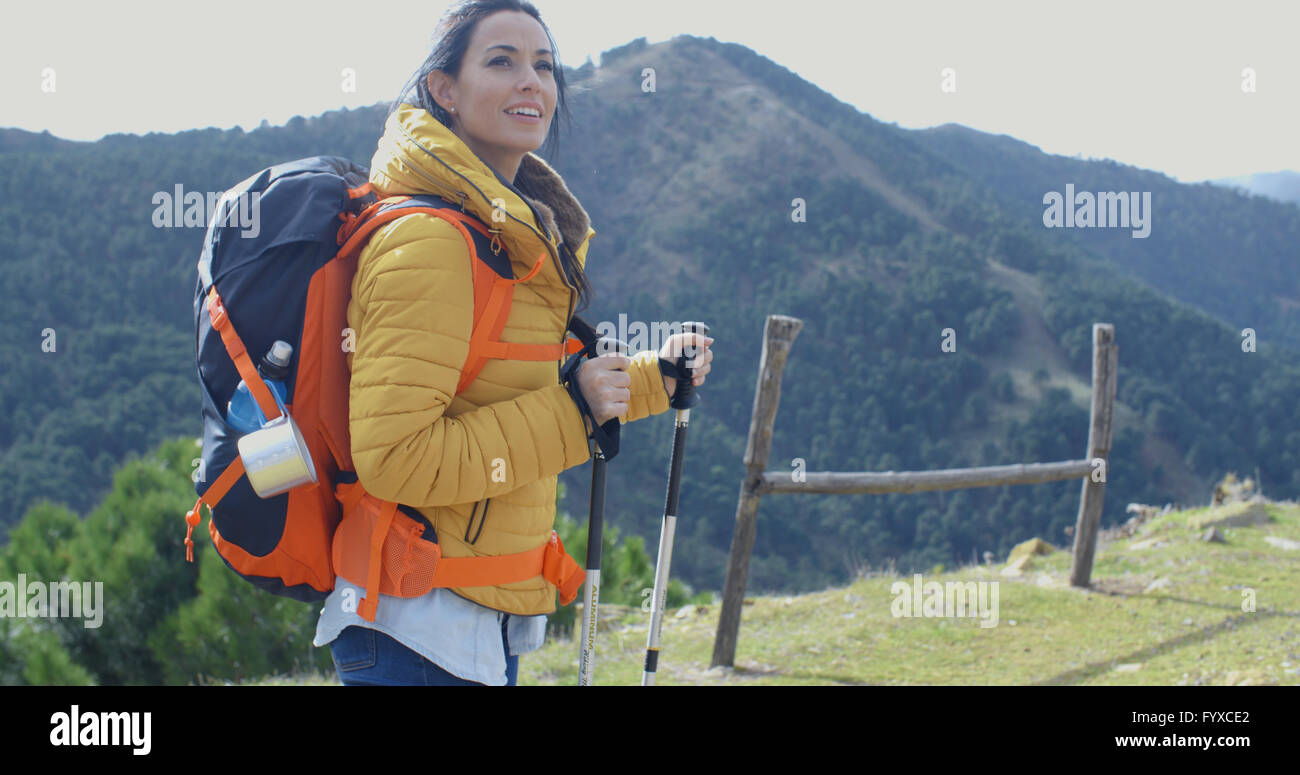 Attractive young woman out backpacking Stock Photo