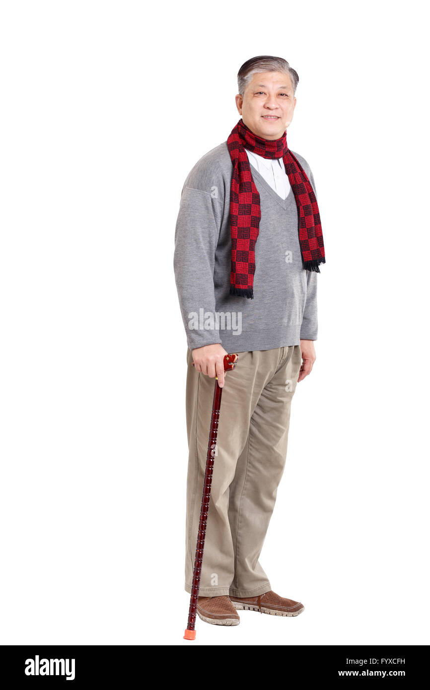 Asian old man in sweater and scarf with cane Stock Photo