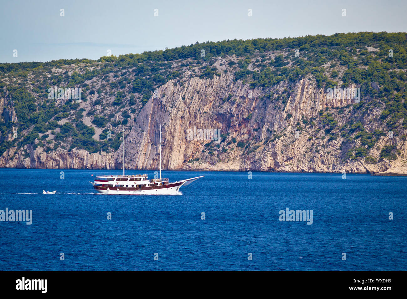 Island of Solta cliffs boat cruising Stock Photo