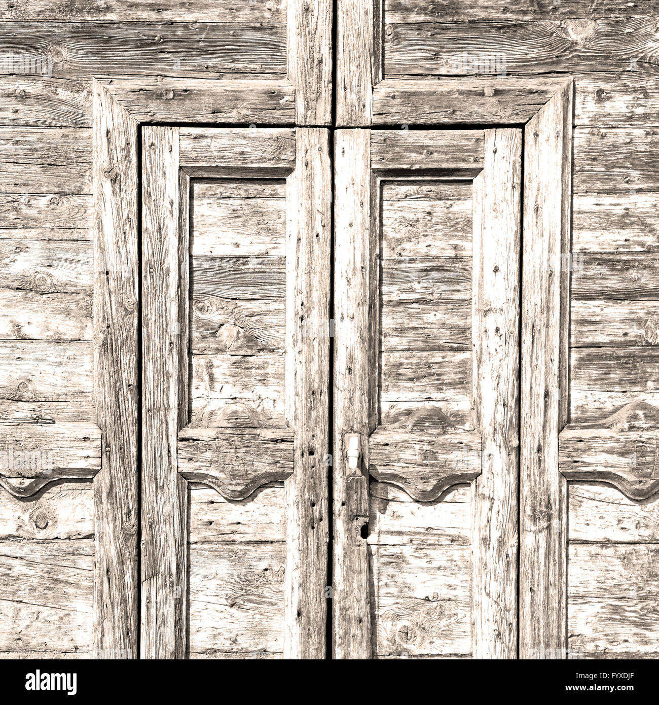 grain texture of a brown antique wooden old door in italy europe Stock ...