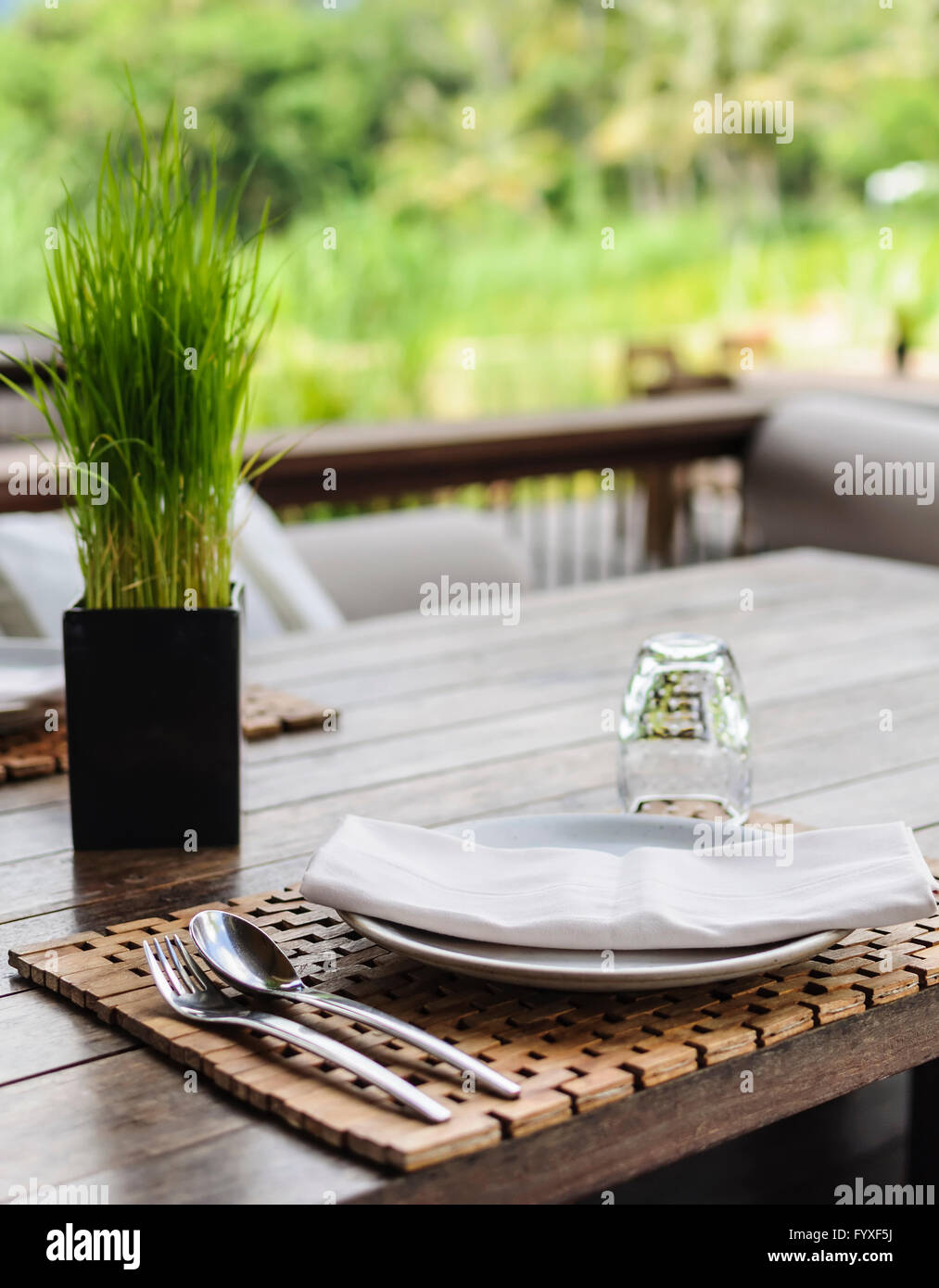Nice Clean Set Table Clean dishes on wooden table on green background Stock Photo - Alamy