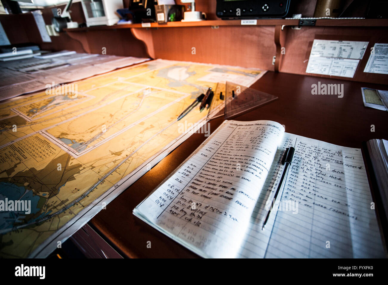 Maritime navigation maps on board a container ship passing through the Suez Canal. Stock Photo