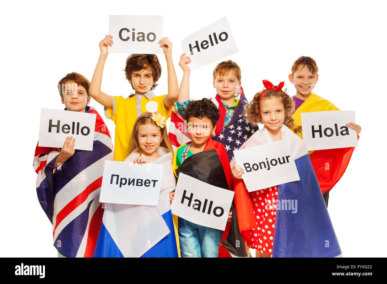 Kids holding greeting signs in different languages Stock Photo