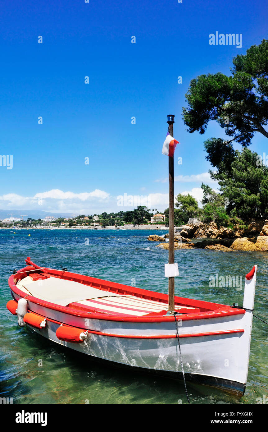a fishing boat moored in a quite cave in the Mediterranean sea, in the French Riviera, France Stock Photo