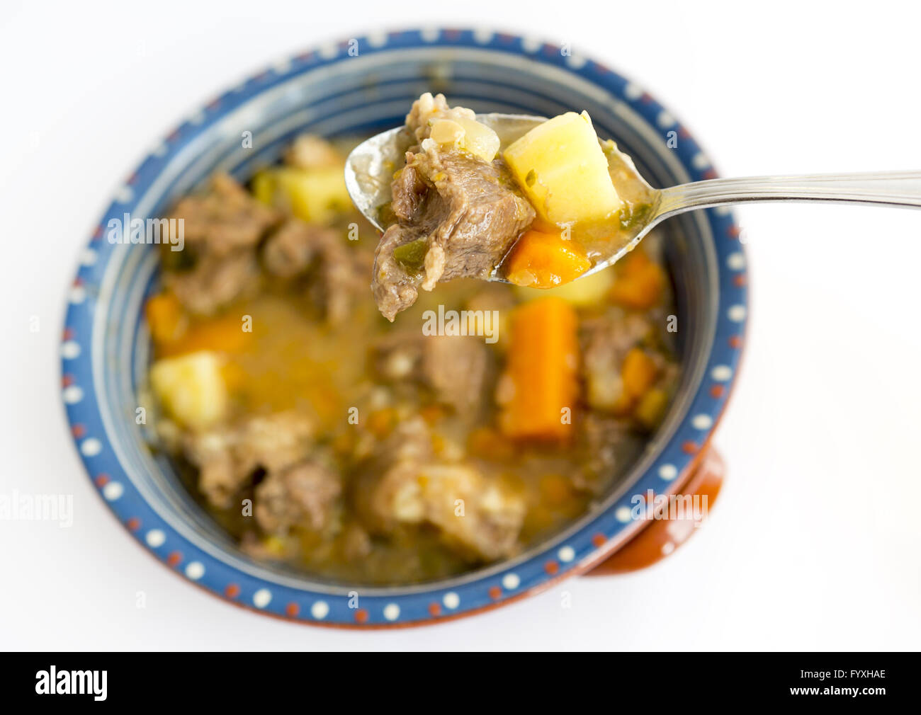 Beef stew in a spoon Stock Photo Alamy