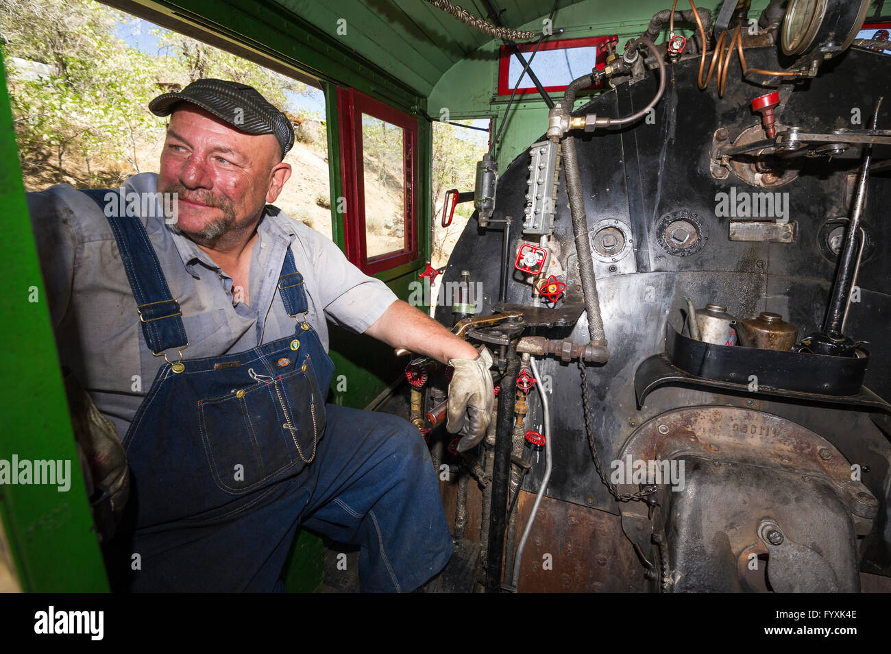Fireman Ed Gallegos takes a break from stoking the fire on steam train.  Virgina & Truckee Railroad Stock Photo