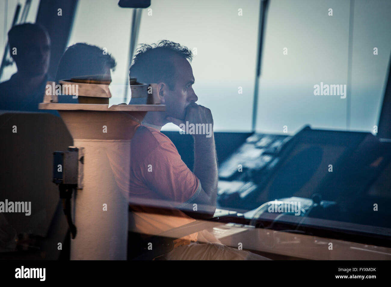 Officers onboard a container ship while at sea Stock Photo