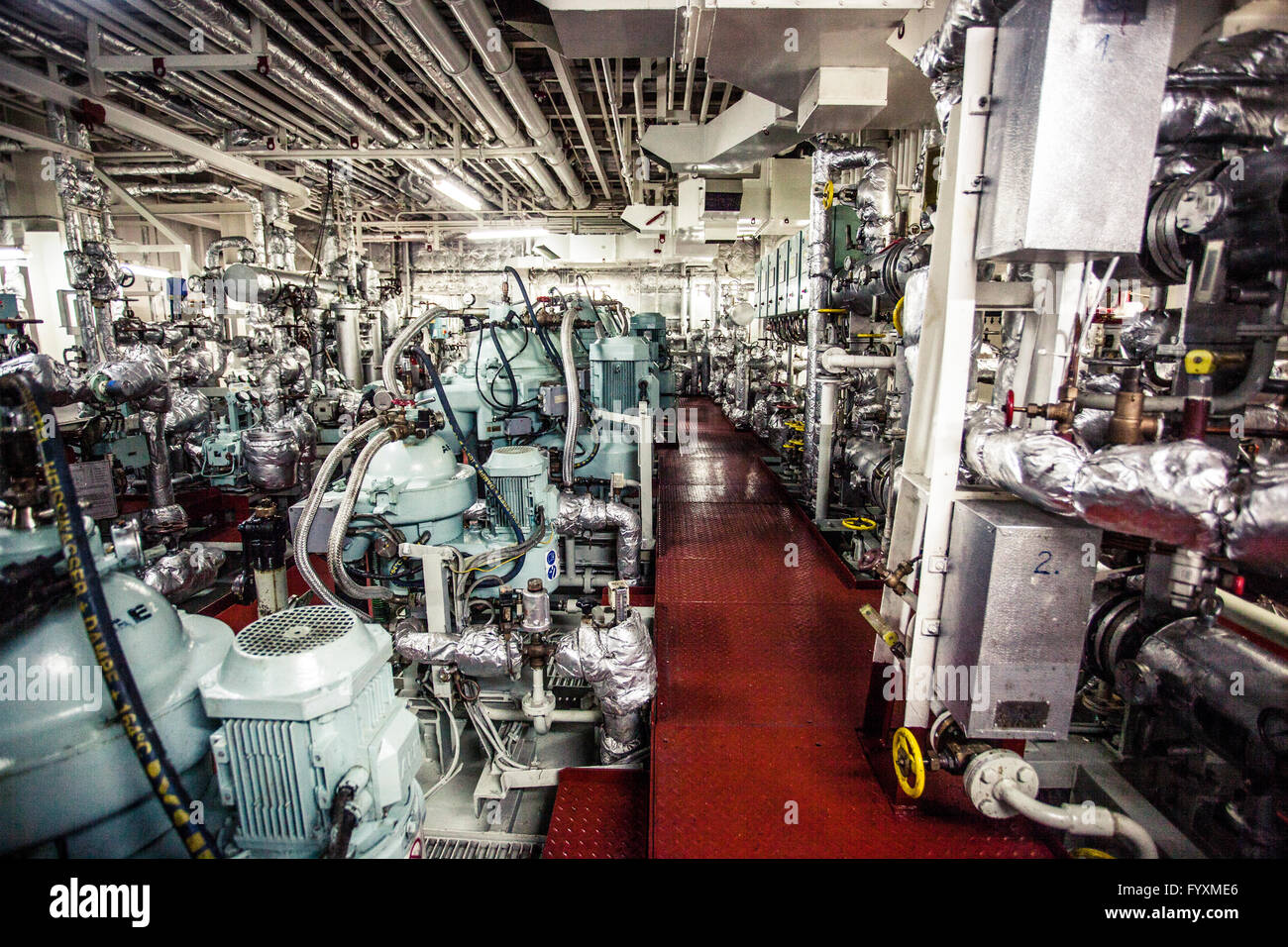 Life support systems (water pumps, air conditioning units, etc.) on board a container ship at sea. Stock Photo