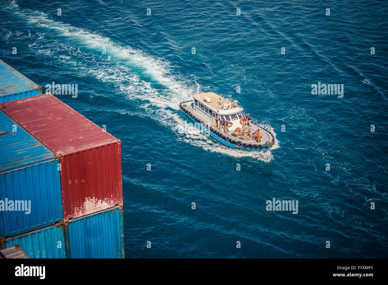 Security forces approaching a container ship in the Suez Canal Stock Photo