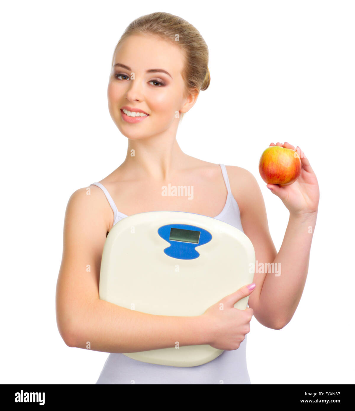 Young healthy girl with apple and scales isolated Stock Photo Alamy