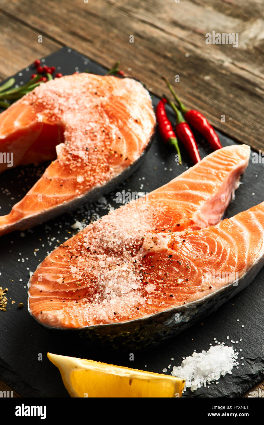 Raw salmon steaks Stock Photo - Alamy