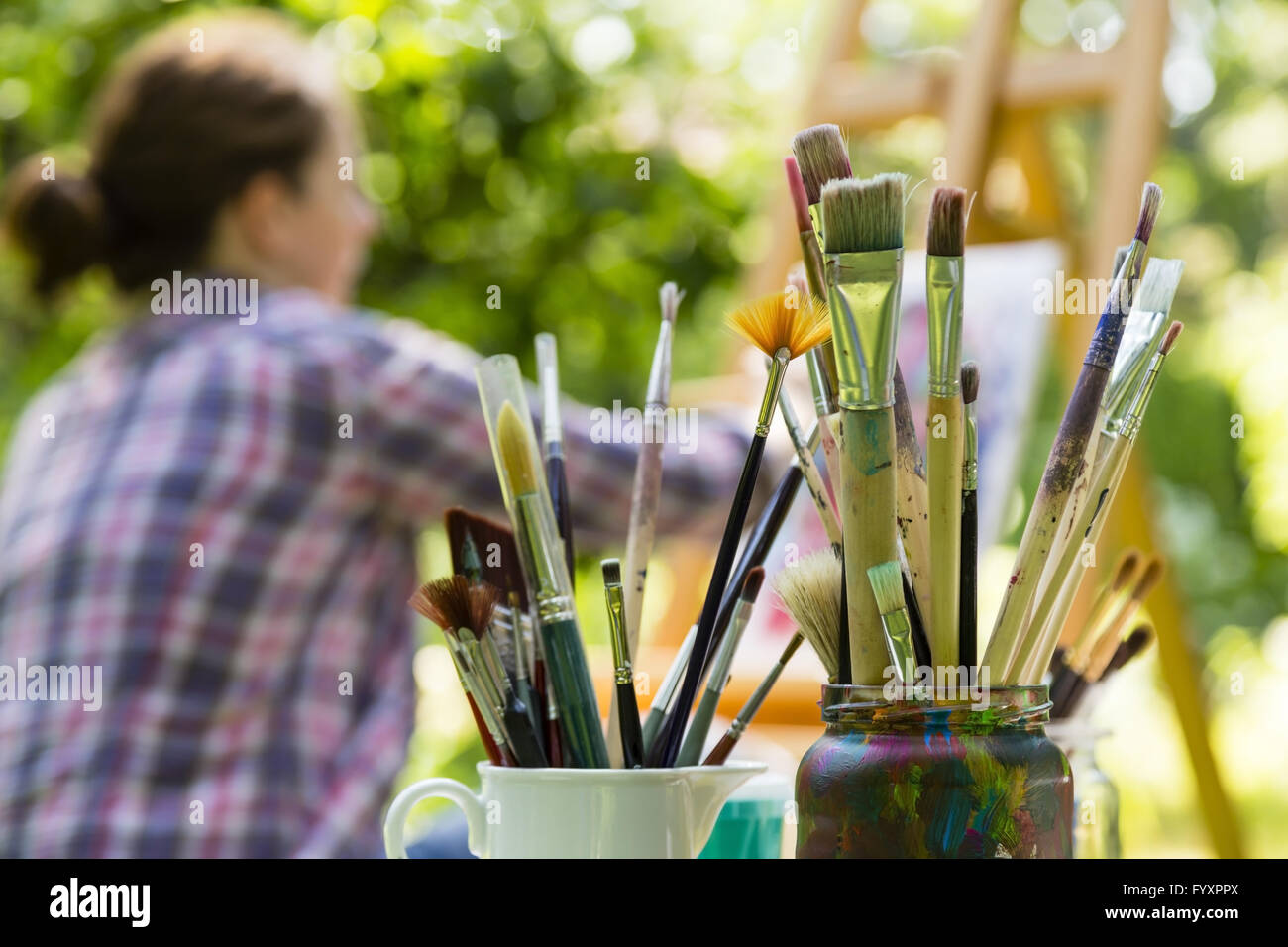 woman painting with paint brush Stock Photo