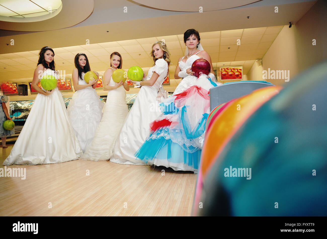 funny brides  on the bowling club Stock Photo