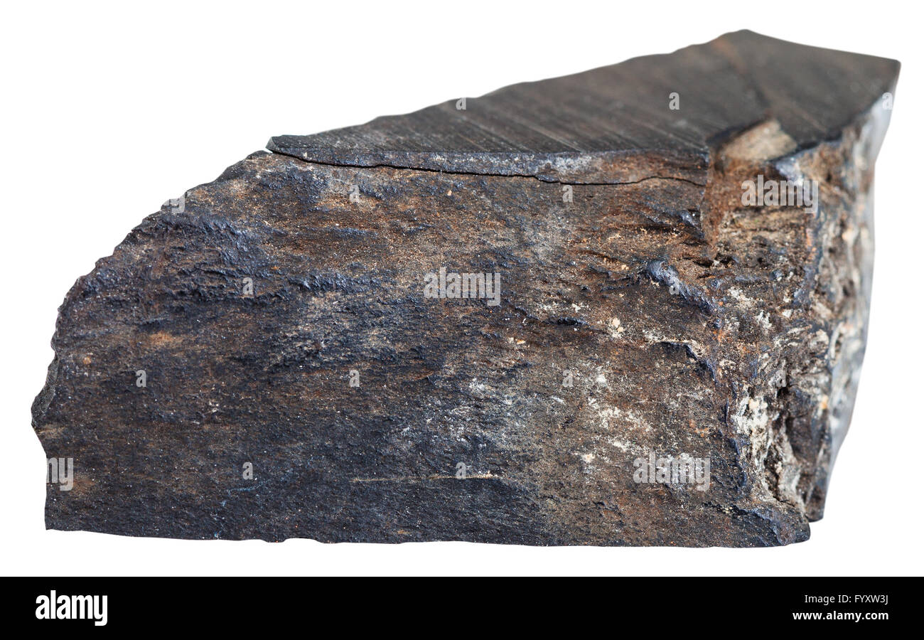 macro shooting of natural mineral stone - piece of raw Jet (lignite, brown coal) gemstone isolated on white background Stock Photo