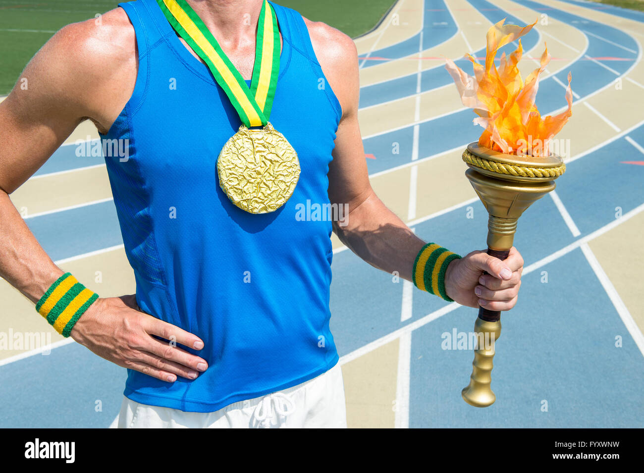 Gold medal athlete holding ceremonial sport torch with inspirational