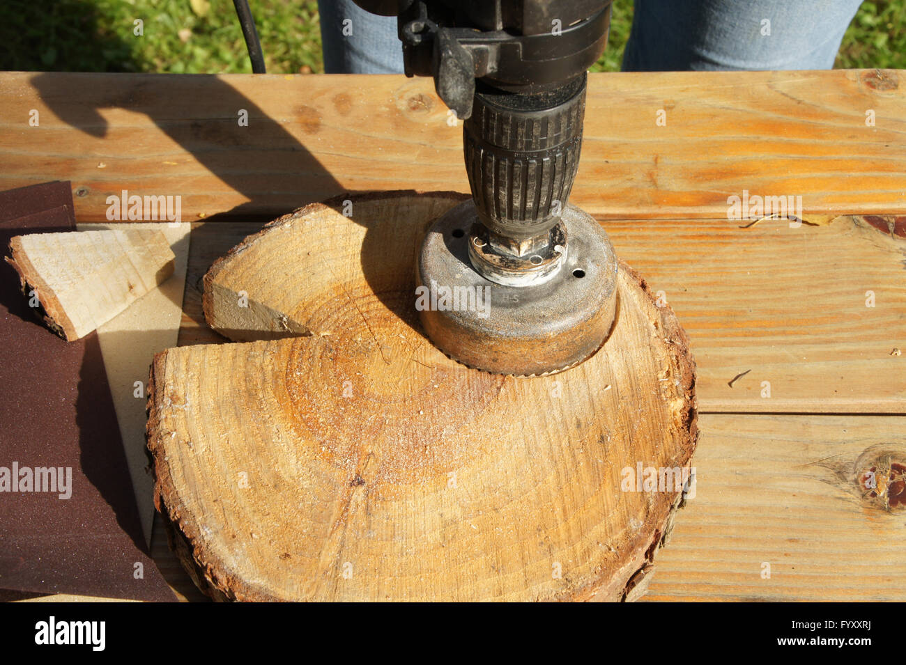 Sawing cedar-wood slices Stock Photo