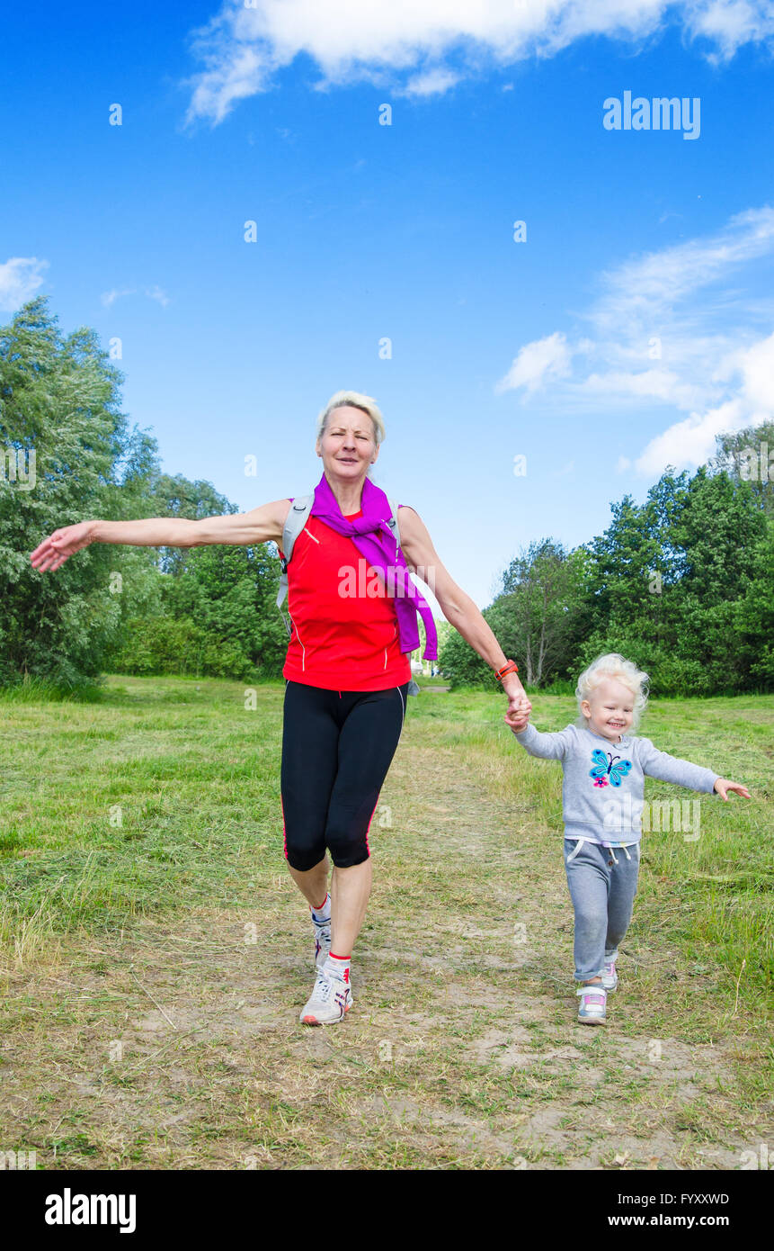 A woman with a child on the sports outing Stock Photo