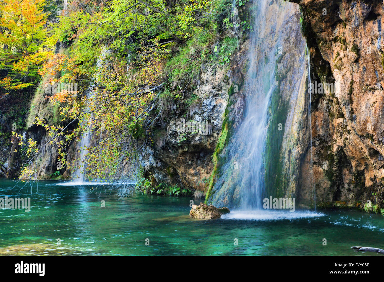 Waterfall in forest. Crystal clear water. Stock Photo