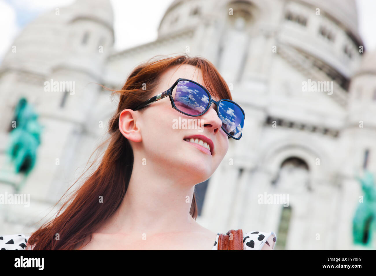 Girl near Sacre-Coeur Basilica. Paris, France Stock Photo