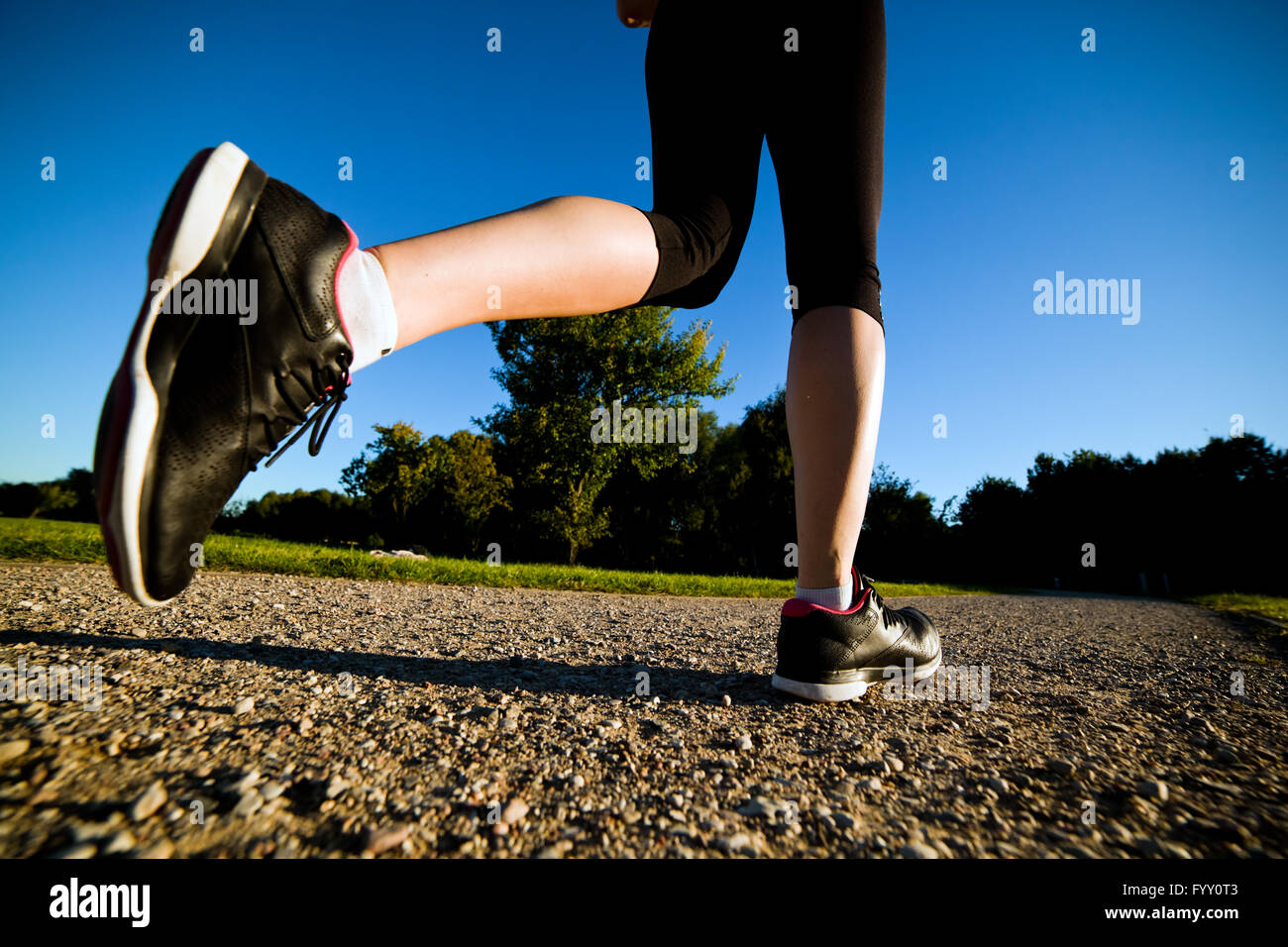 Young fit woman does running Stock Photo