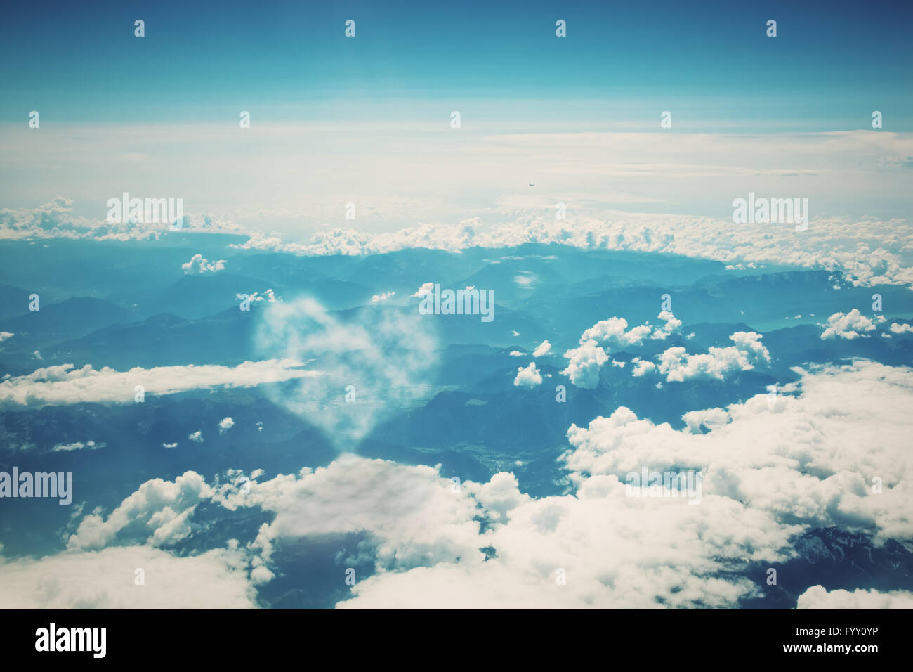 Heart shaped cloud on blue sunny sky. Love Stock Photo - Alamy