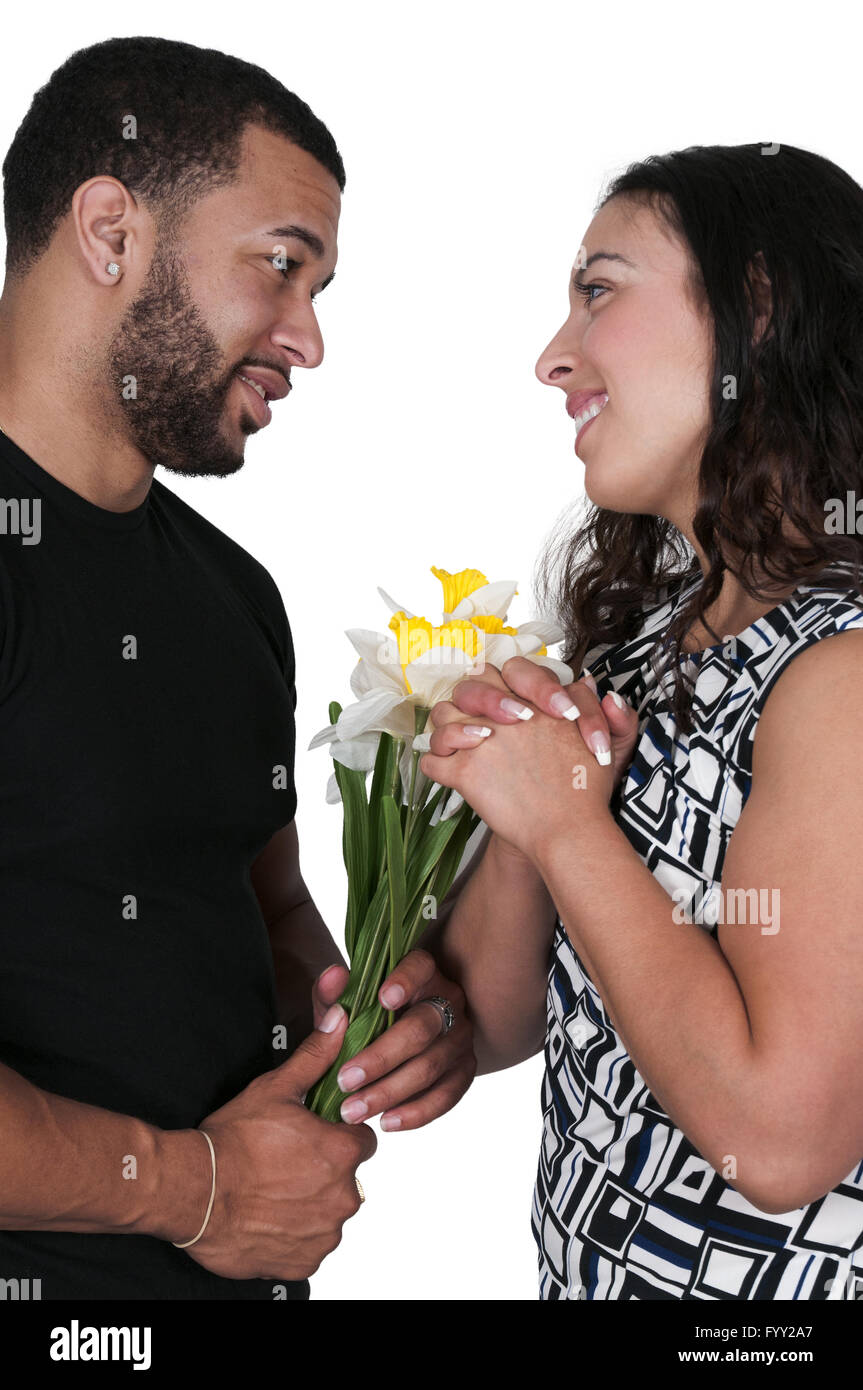 Husband giving wife flowers Stock Photo Alamy