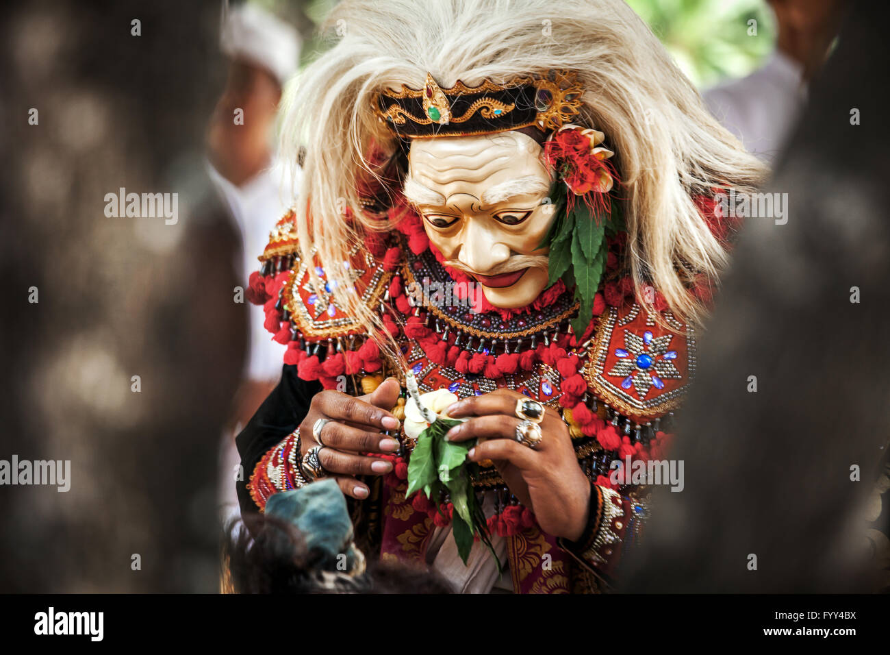Balinese man wearing bali mask and preparing for Tari toping mask dance Stock Photo