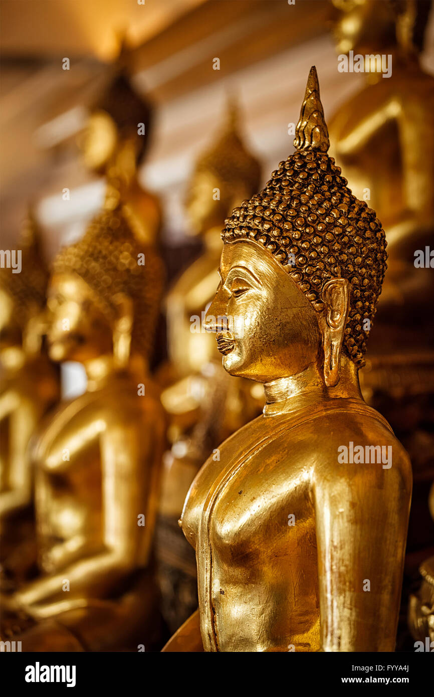 Golden Buddha statues in buddhist temple Stock Photo - Alamy