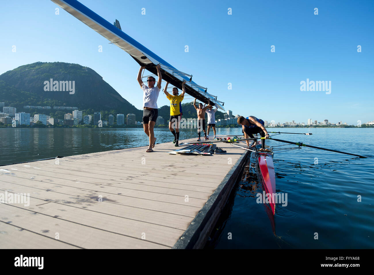 RIO DE JANEIRO - MARCH 22, 2016: Brazilian rowers carry their boat back ...