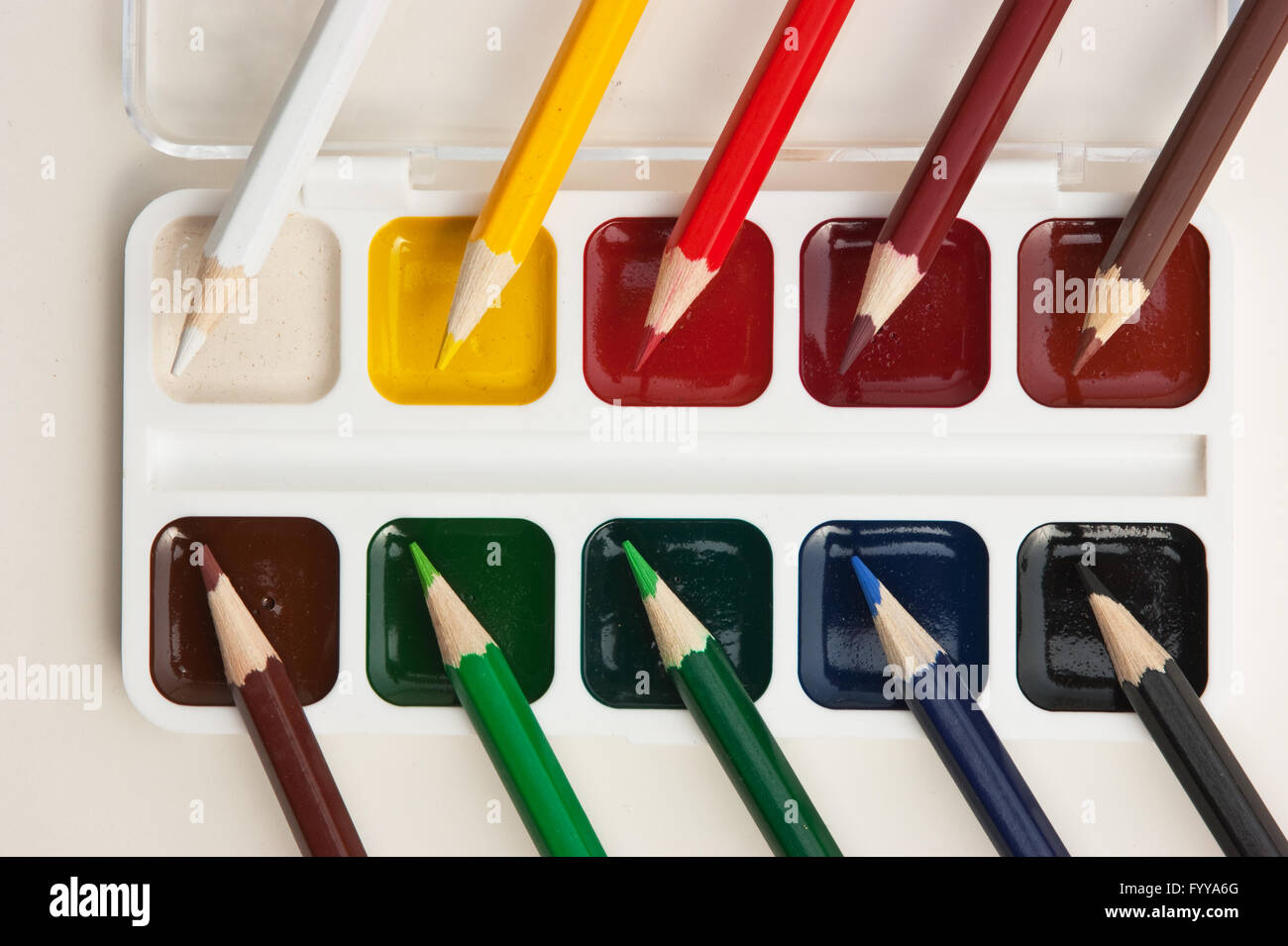 colored pencils and watercolor paints Stock Photo Alamy