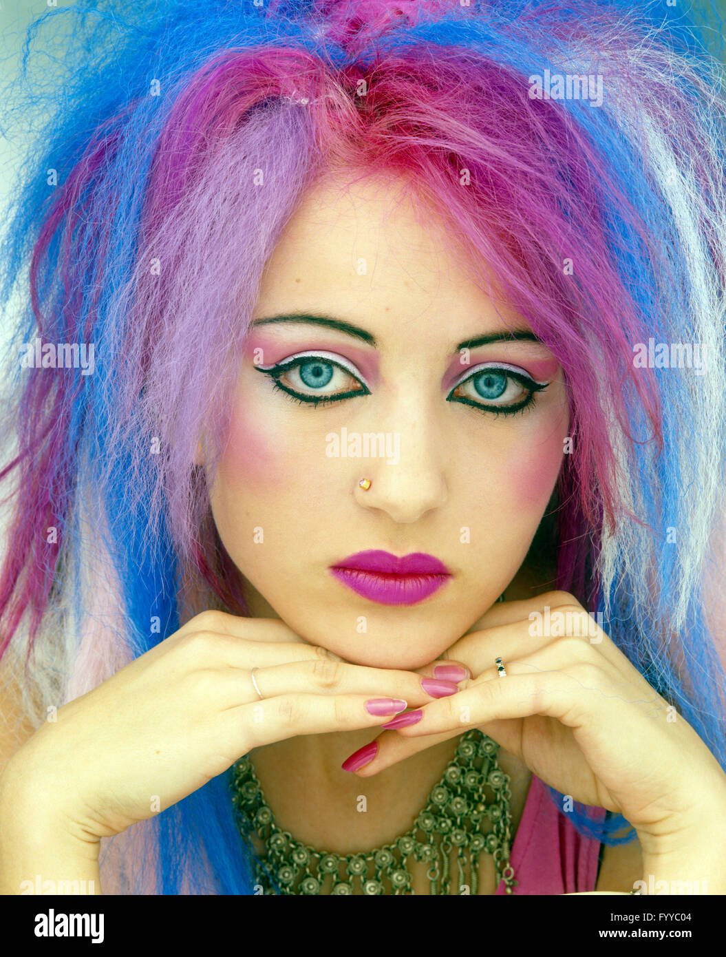 Punk girl with multi-coloured pastel hair, inside. Stock Photo