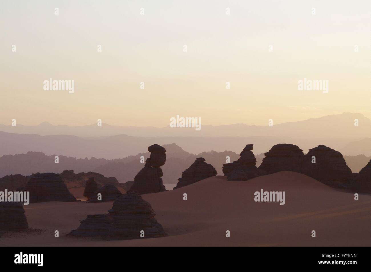 peaceful countryside: natural rock sculptures in Tibesti in the Chadian Sahara in sunset - 3 December 2013 Stock Photo