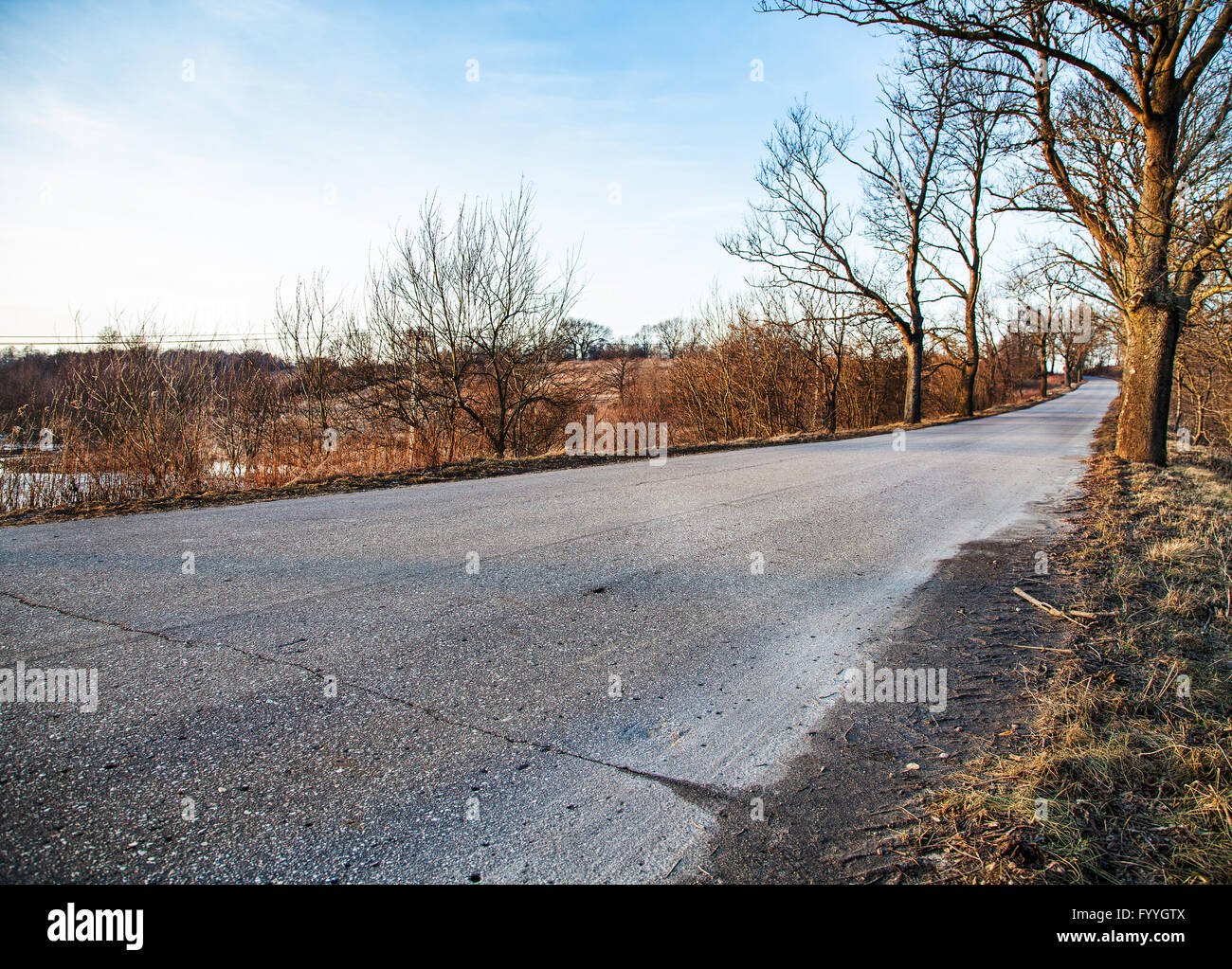 road stretches into the distance in the autumn Stock Photo - Alamy