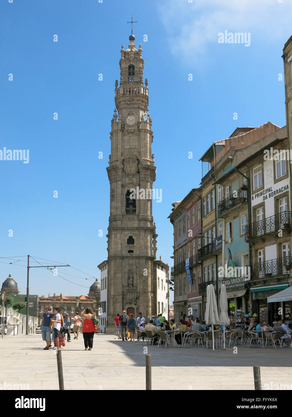 Street with people and Torre dos Clerigos or Clerigos Tower is bell tower of church with same name in Porto, Portugal Stock Photo