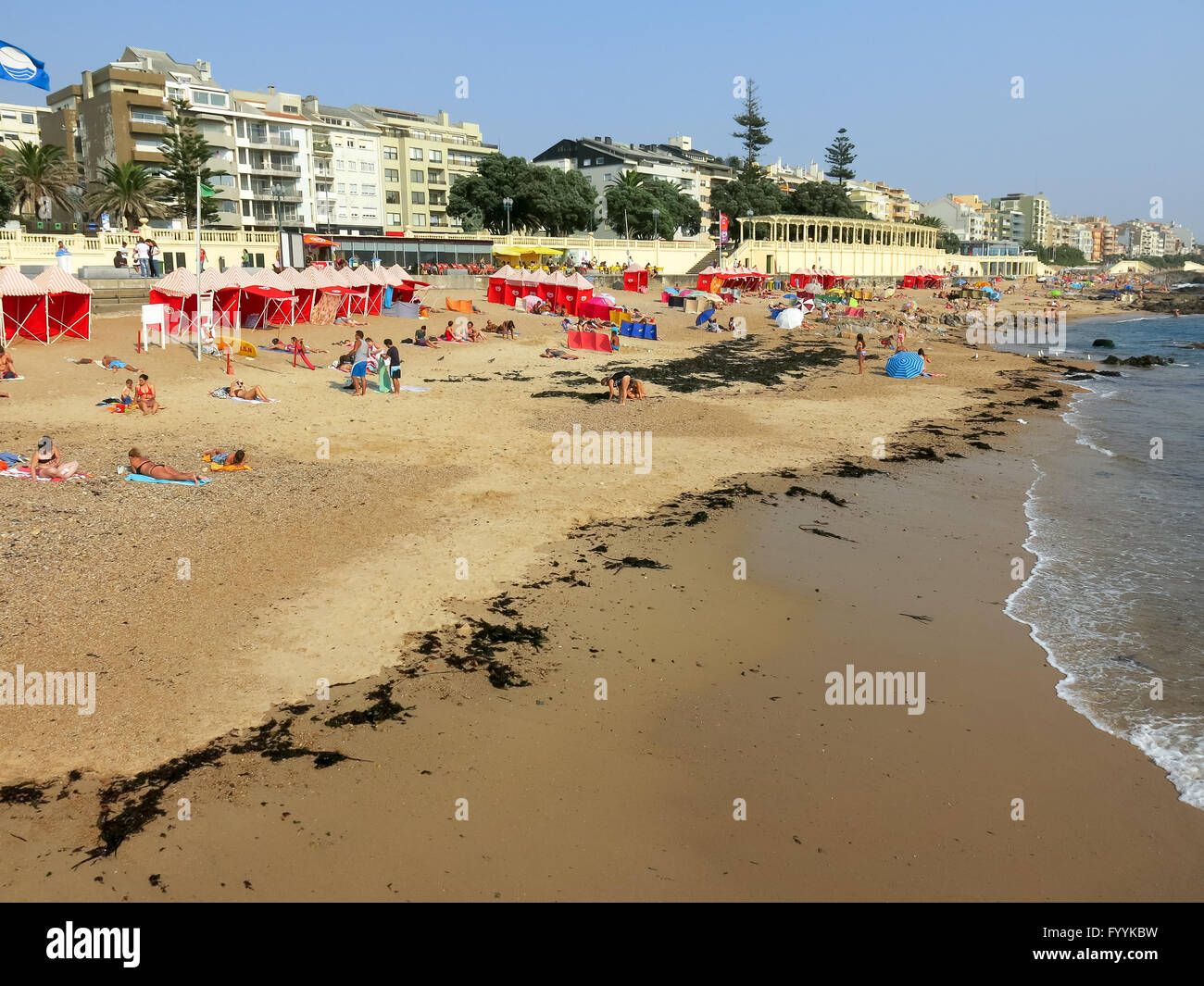 People enjoying sunshine on the beach of Foz do Douro, the Atlantic Ocean coast near Porto in Portugal Stock Photo
