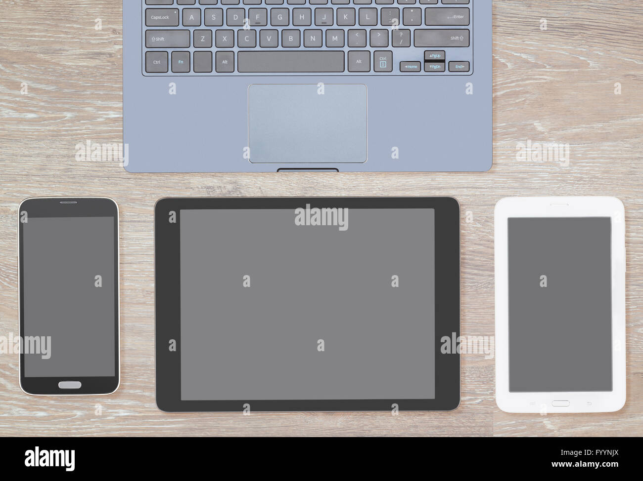 Overhead top view of wooden desk with computing gear Stock Photo Alamy