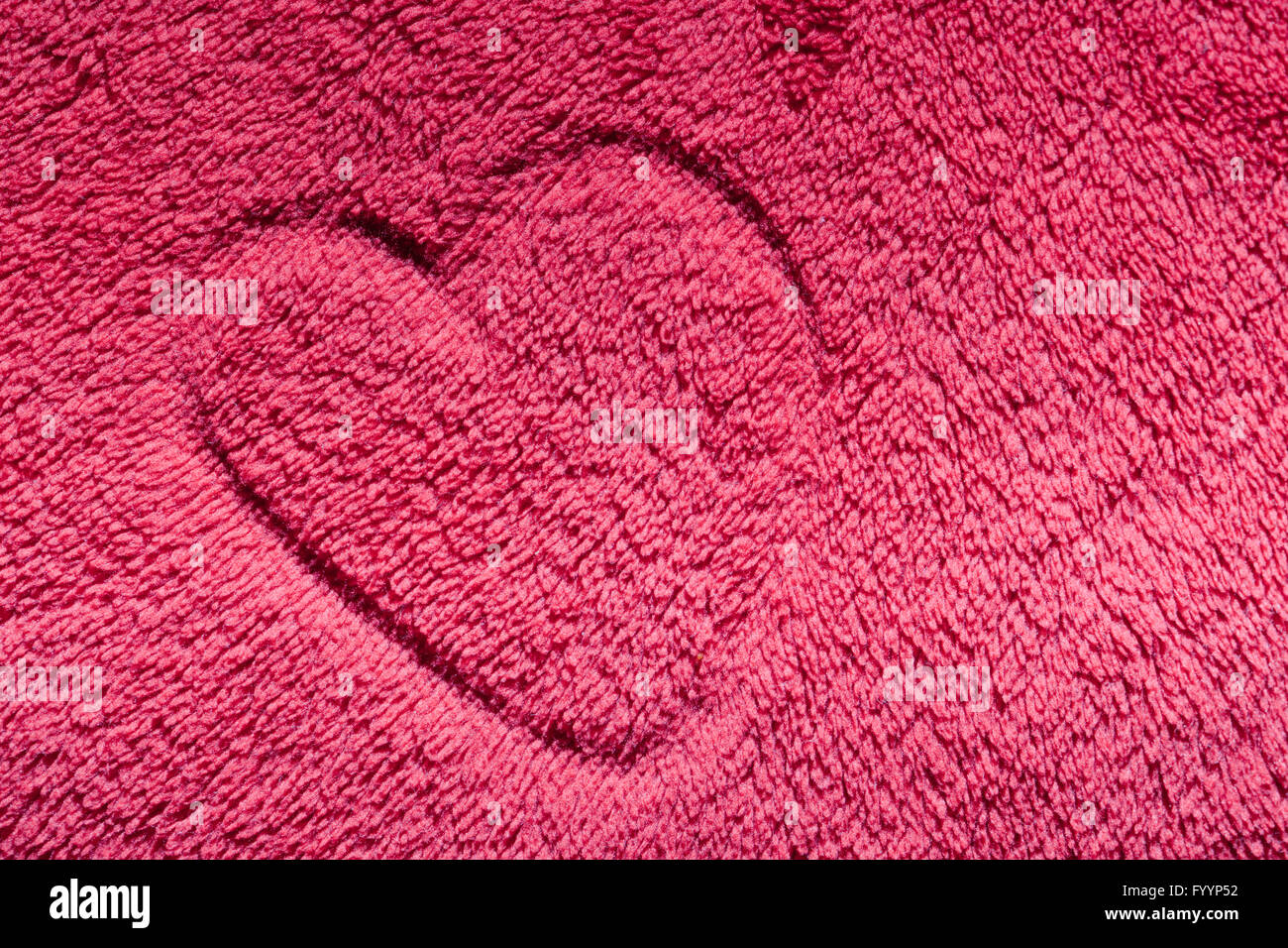 Heart on red furry cloth Stock Photo
