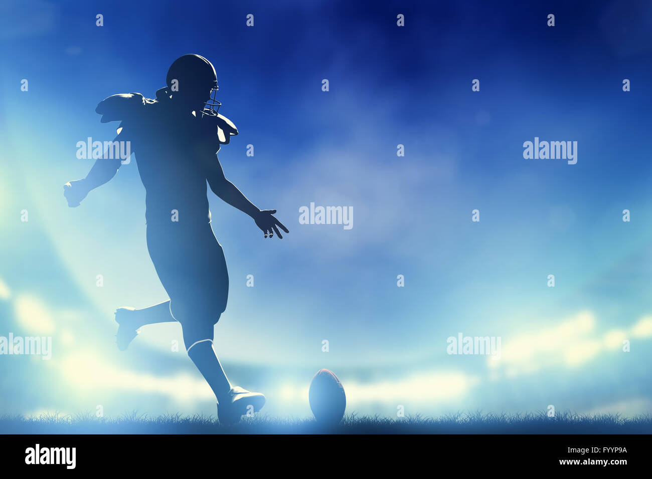 American football player kicking the ball Stock Photo Alamy