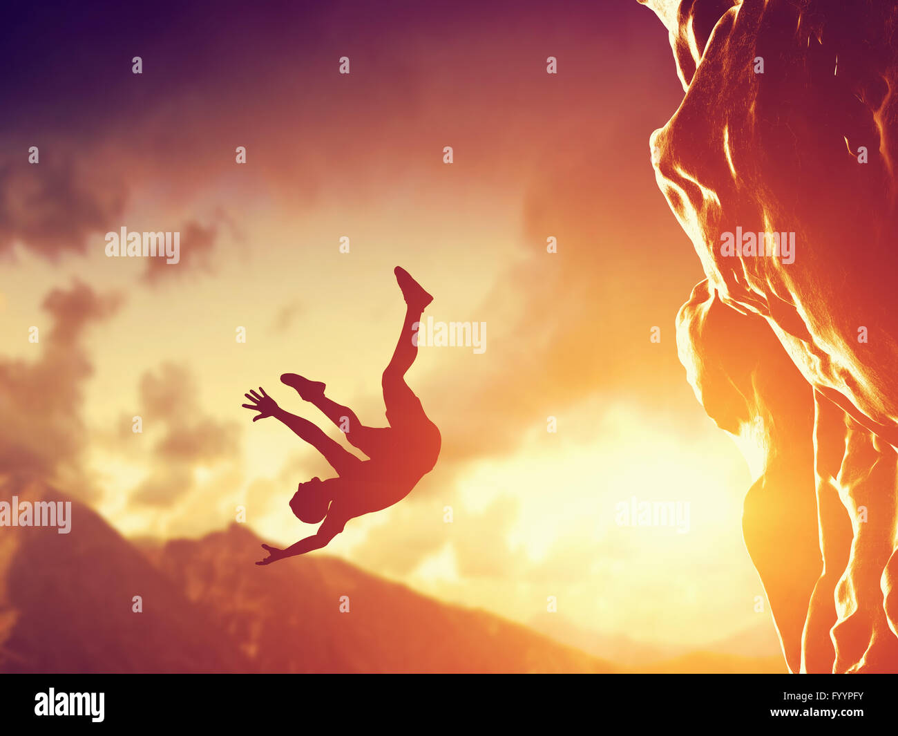 Man falling down the mountain Stock Photo