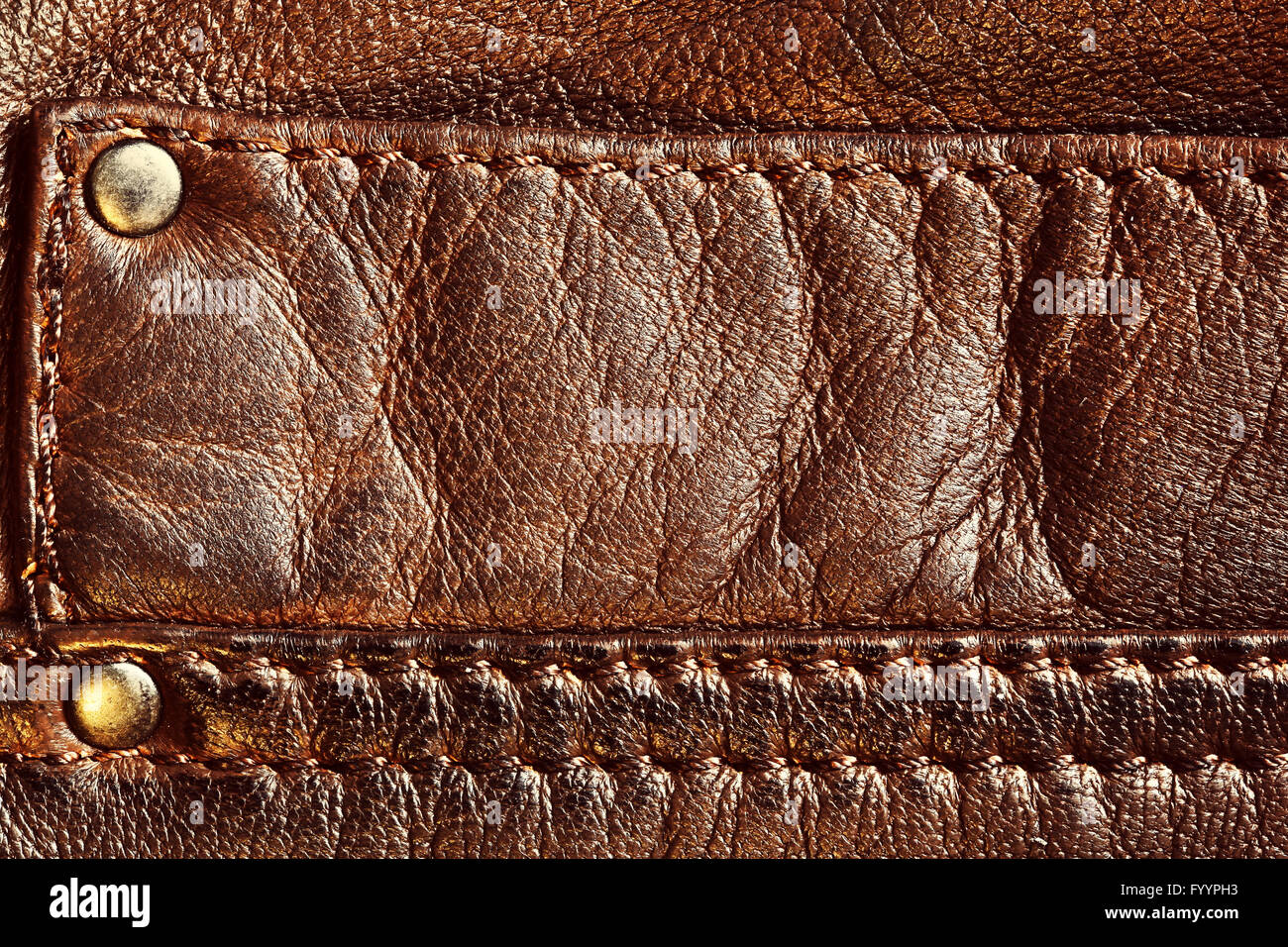 Genuine brown leather with seam. Background Stock Photo