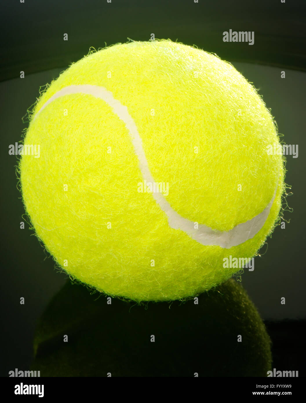 Tennis ball over black background Stock Photo - Alamy